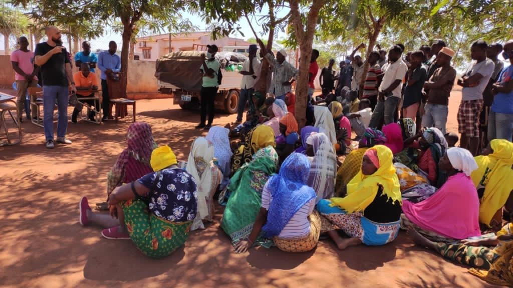 Women sitting under a tree and waiting for an assistance 