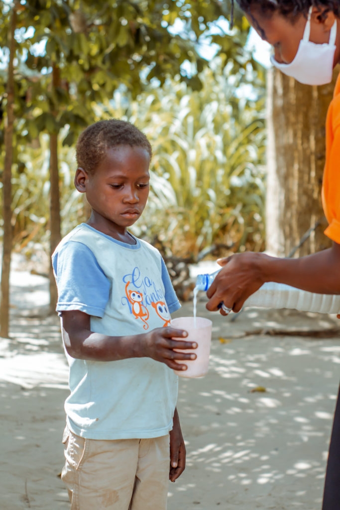 Joel receiving goats’ milk to build his immunity 