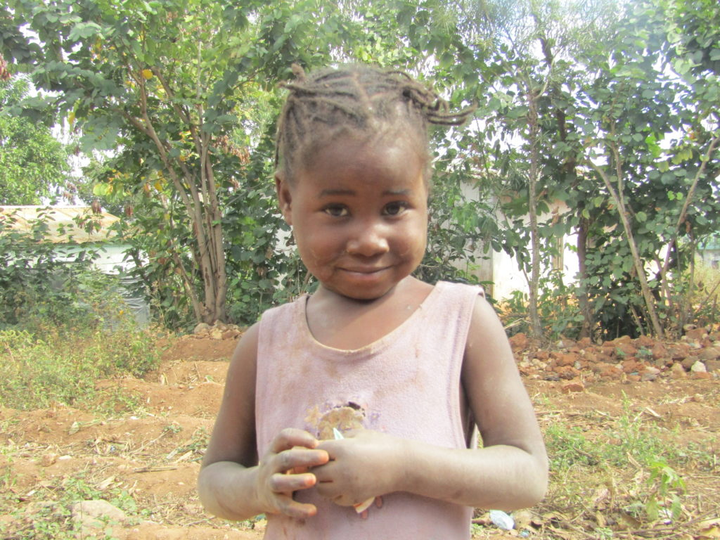 Mercy at her home found playing with friends