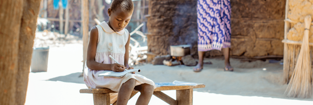 A Mozambican girl studying at home