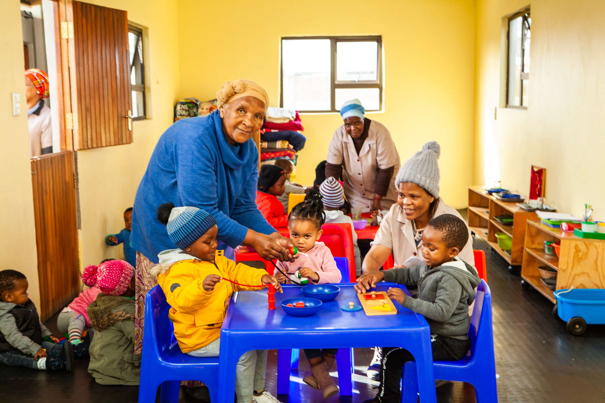 Ntsiki assisting children