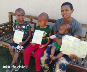 Zikhona and her children with the new birth certificates