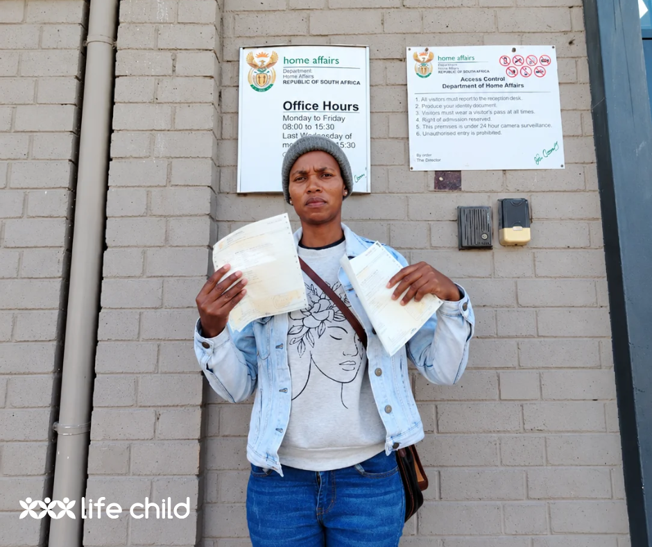 Zikhona at Home Affairs with her children's new birth certificates