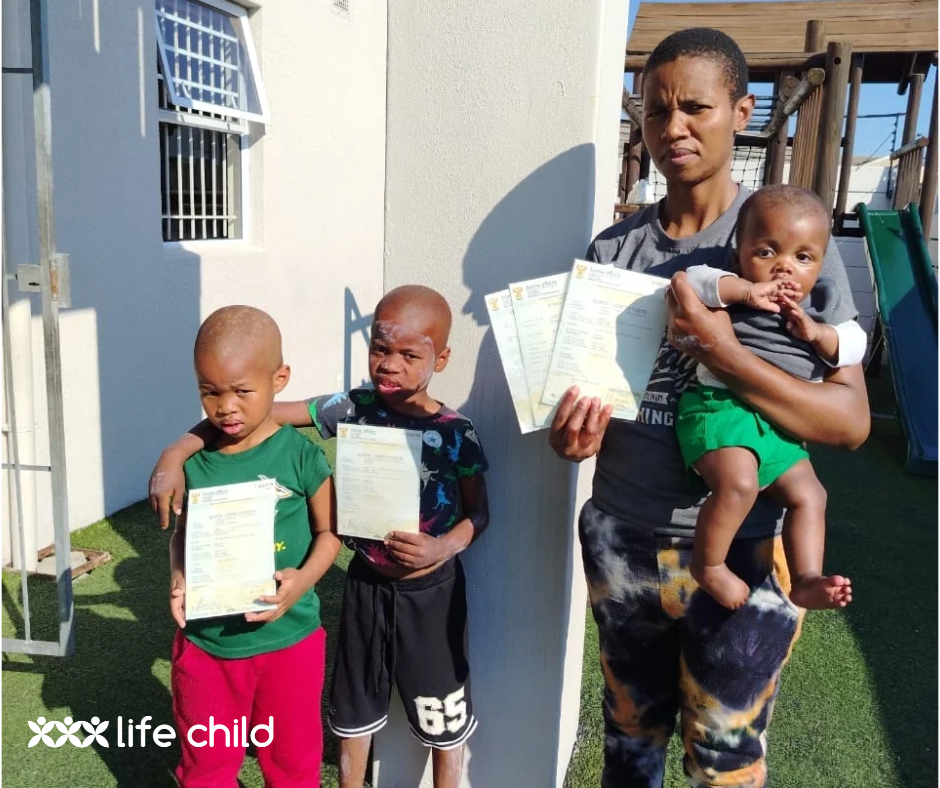 Zikhona and her children with the new birth certificates 2